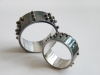 Oxidized sterling silver wedding rings with Braille text	