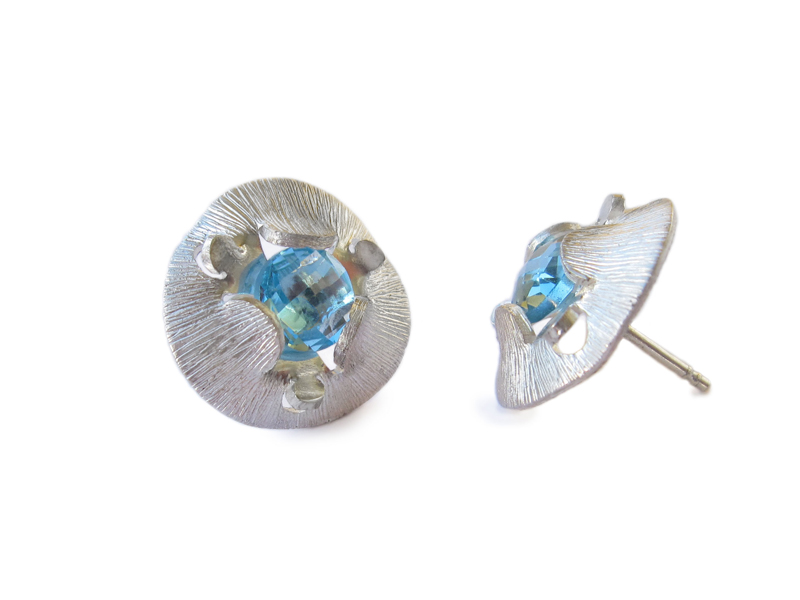 Sterling silver stud earrings with blue topaz